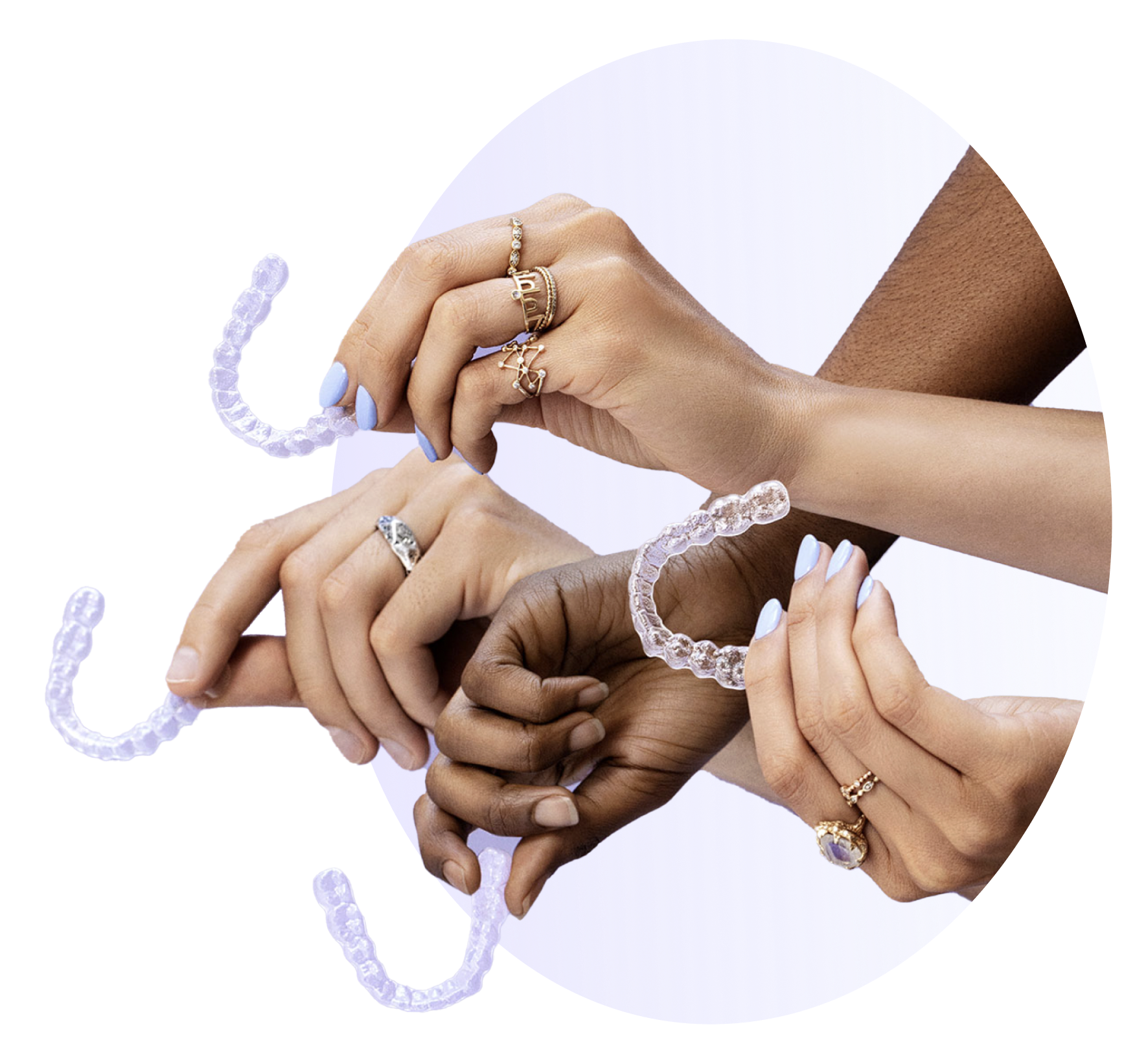4 different, isolated hands outstretched holding clear teeth retainers.