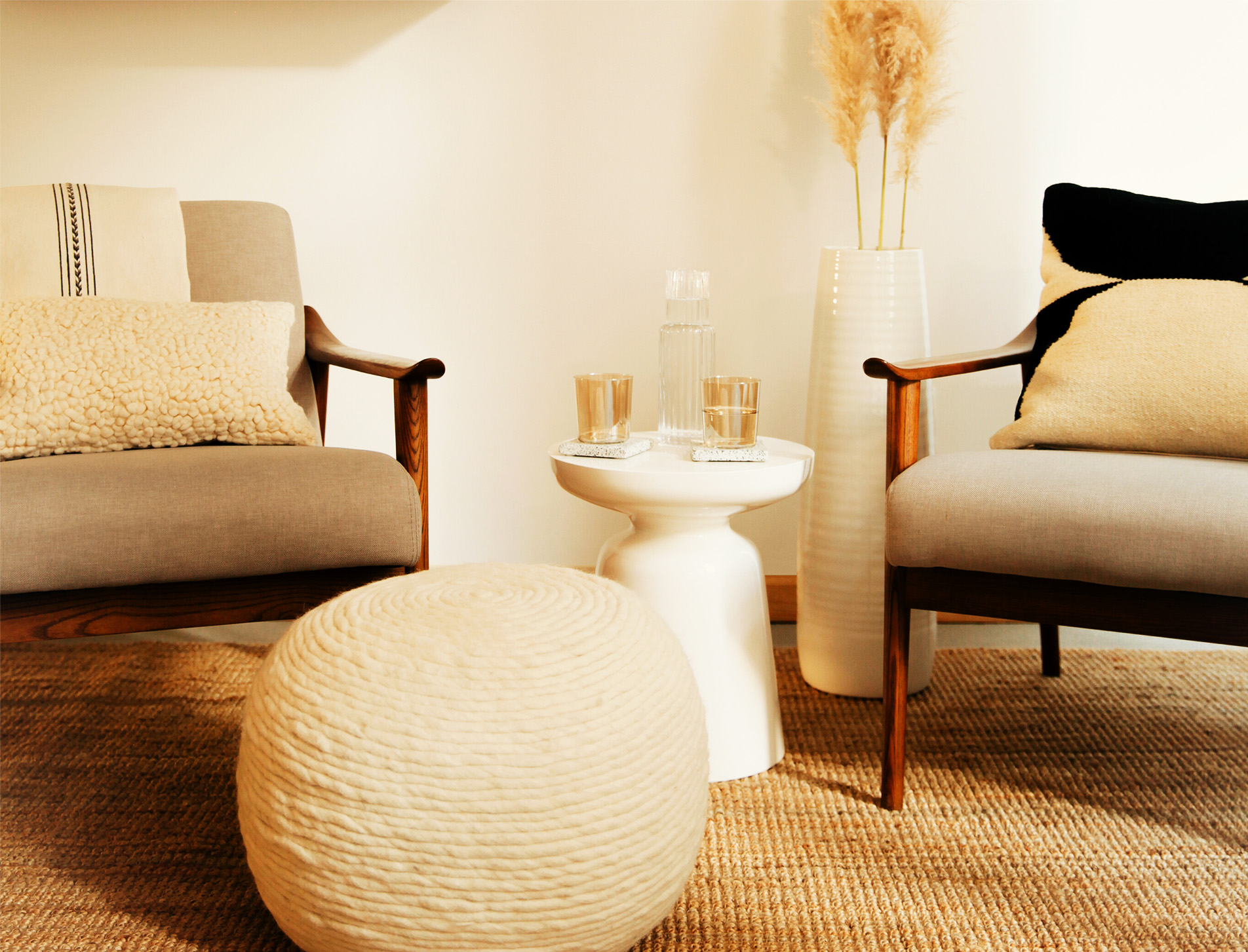Serene photo of two chairs in a neutral office.
