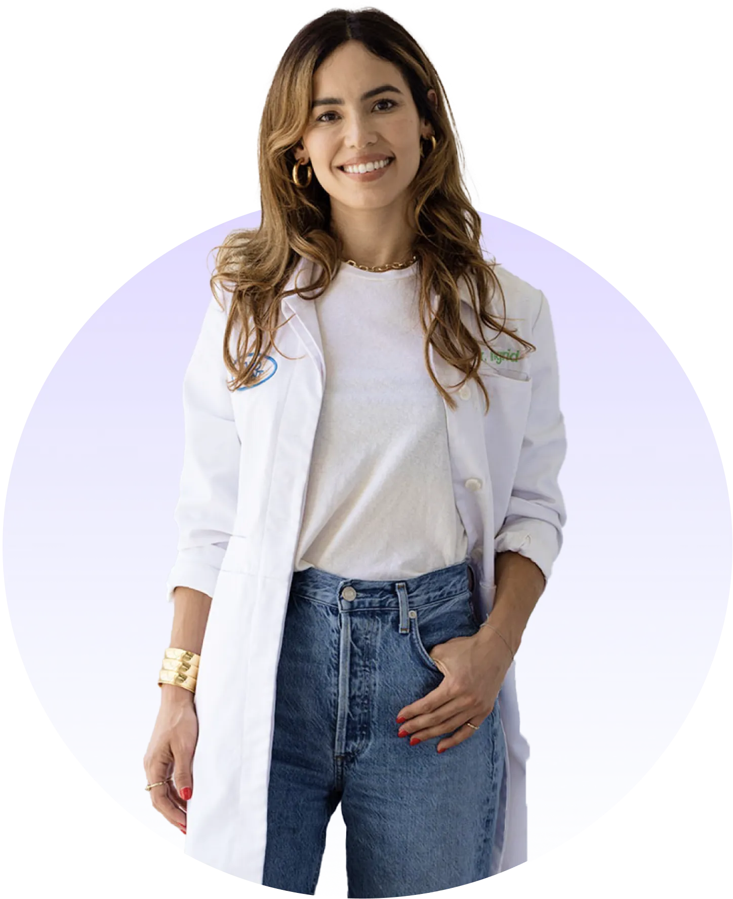 A smiling portrait of a Dr. Ingrid Murra, dressed in a dentist's white coat.